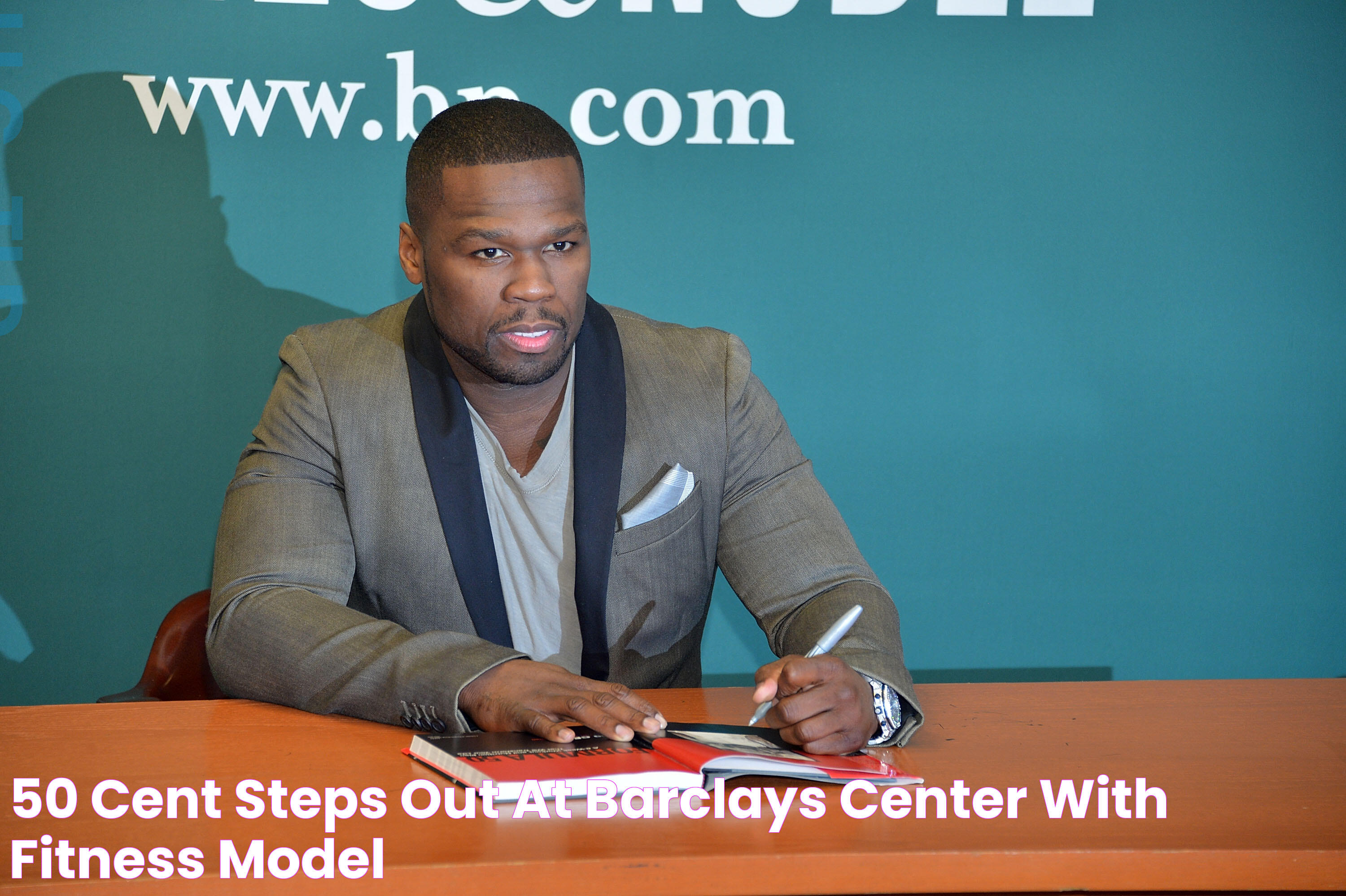 50 Cent Steps Out At Barclays Center With Fitness Model